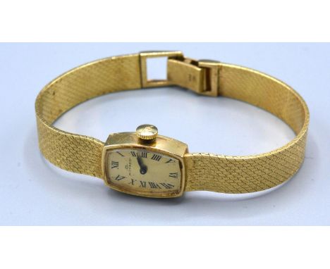 A 14ct Gold Cased Ladies Wrist Watch by Movado 19.2 gms excluding movement and glass 