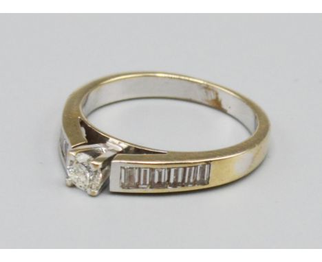 An 18ct White Gold Solitaire Diamond Ring, with diamond shoulders, approximately 0.10 ct. 3.2 grams, ring size K 