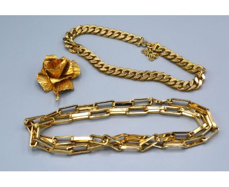 A Heavy Linked Necklace by Christian Dior together with another similar curb link and a brooch of flower head form by Christi