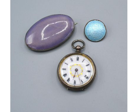 A Kensington Art Ware Ruskin Style Brooch together with an enamel set brooch and a silver cased fob watch 