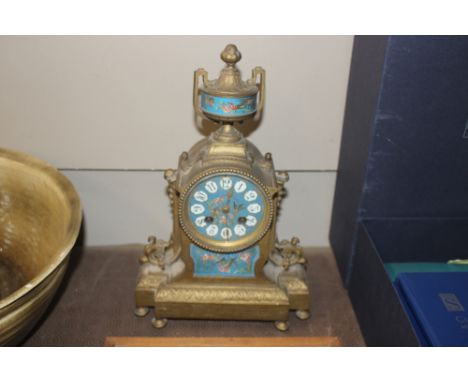 A 19th Century French gilded mantel clock having Sevres type panels, 8 day movement striking on a bell, 34cm high