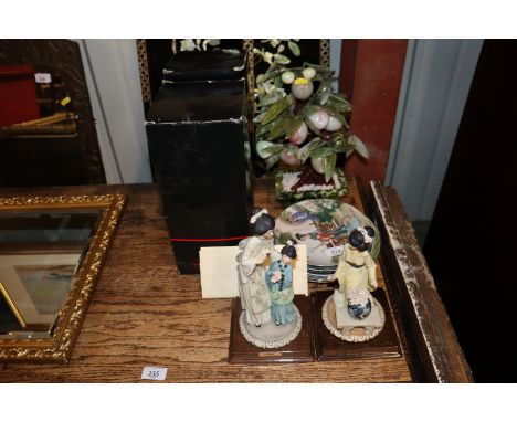 A pair of Oriental lacquered panels; a hardstone jade style Bonsai type tree and other Oriental ornaments