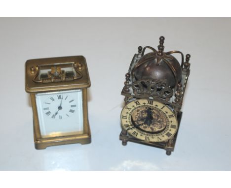 A brass cased carriage timepiece; and a small brass lantern type clock 