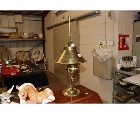 A brass adjustable table lamp