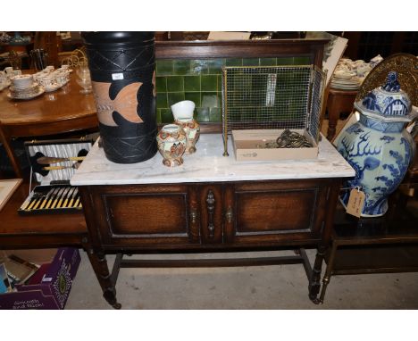 An Edwardian oak marble topped and tile back washstand 