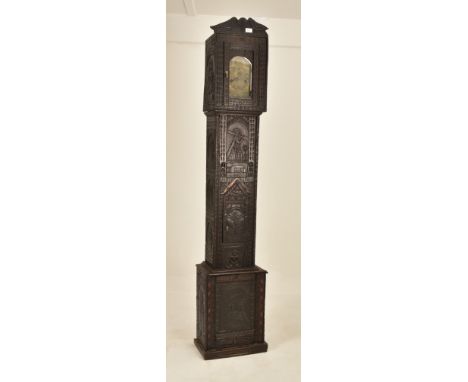 A Dutch Flemish 19th century ebonised carved oak 8-day movement longcase clock. The clock having brass clock face with Roman 