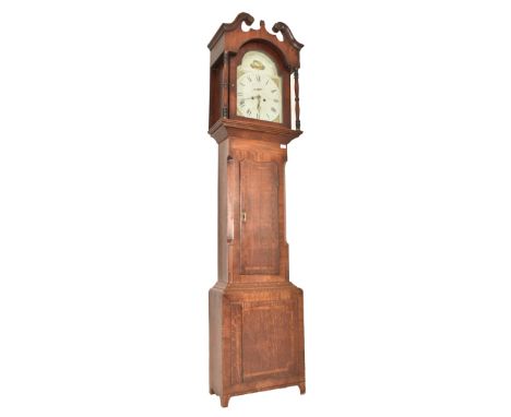 A 19th century George III oak and mahogany longcase eight day grandfather clock. The clock having an arched painted clock fac