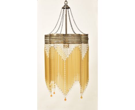 An Art Deco inspired 20th century brassed metal &amp; glass rod ceiling chandelier light. The chandelier having central colum