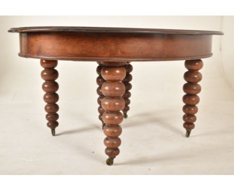 A large Victorian 19th century mahogany bobbin leg round extending dining table. The table having a circular top with chamfer