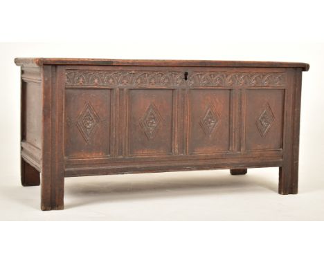 A late 17th century / early 18th century carved oak trunk blanket box chest. The trunk having a straight hinged top over a pa
