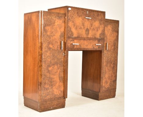 An Art Deco early 20th century 1930s burr walnut fall front drinks cocktail cabinet. The cabinet having a raised central fall