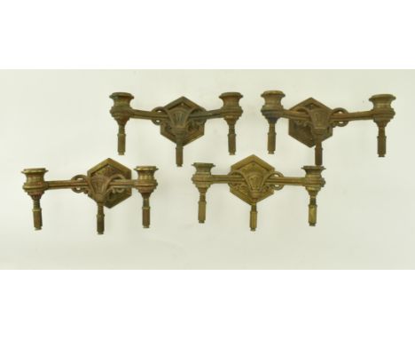 Two pairs of 19th century Neoclassical gilt metal wall sconces. Each having twin arms with architectural elements to decorati