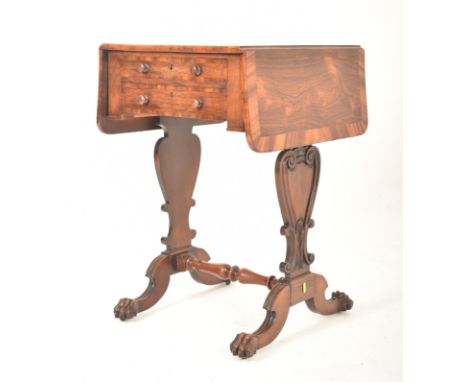 A George IV early 19th century rosewood drop leaf work writing table. The table having a straight top with curved edge drop l