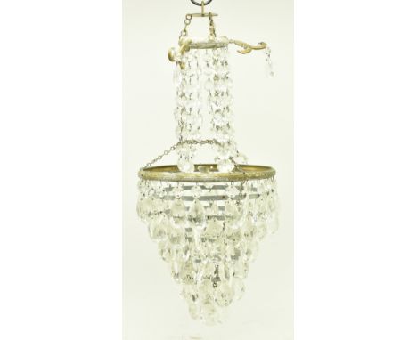 A French Empire Continental early 20th century brass &amp; glass basket chandelier light. The chandelier having a series of g