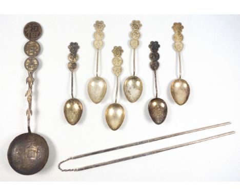 Chinese white metal ladle with a tapering "coin" handle, and 6 small spoons, each with a coin style handle, and a pair of ste