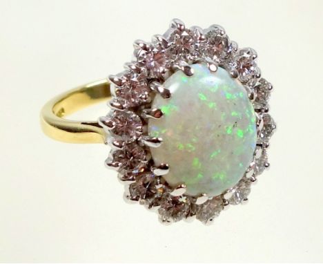 18ct gold and platinum cluster ring, set opal and diamonds (1.4cts), by sponsers H C Ltd, London 1987, gross weight 7.8gramsC