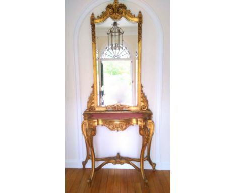 19th century pier glass with an upright bevelled mirror back, carved gilt floral and scroll decoration with floral pendants a