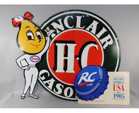 A Sinclair Gasolene H-C circular painted metal sign, 106cm diameter, together with an ESSO cartoon figural sign, and an RC Ro