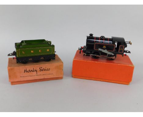A Hornby 0 gauge engine, British Railways black livery, 3/82011, together with a LNER tender, green livery, boxed, (2).