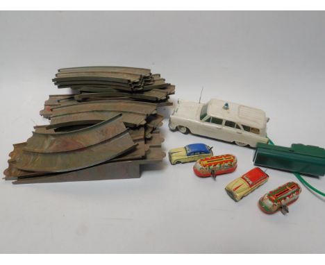 An MAR tin plate clockwork race game, with two cars, and Bakelite vari-coloured track, together with two West German mid 20th