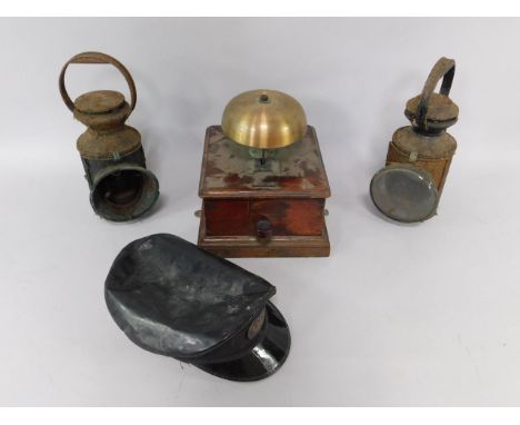 A Midland Railway lantern, further lantern, station bell box, and an LMS cap, (4).