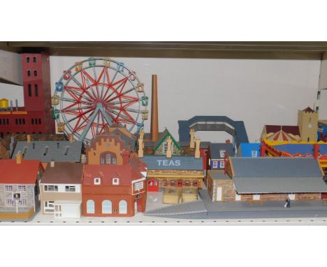 Hornby and Tri-ang trackside buildings, a railway station, footbridge, fairground, engine sheds, and sundries, (qty).