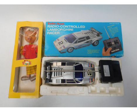 A Pelham Rupert The Bear Puppet, boxed, and a Radioshack remote controlled Lamborghini Racer, (2).