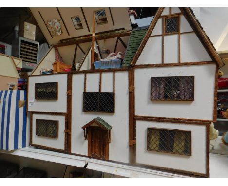 A Tudor style scratch built collector's dolls house, 1:12 Scale with Dorma style windows, three chimney stacks and windows wi