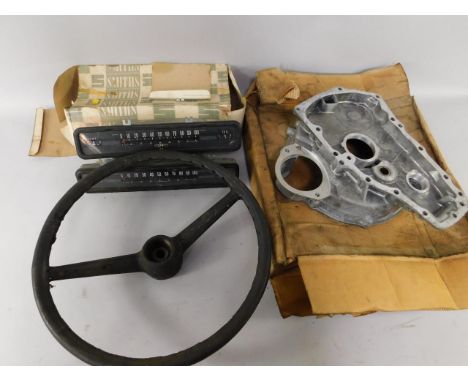 A British Leyland engine part, two Smith's speed ohmmeter and mileometer gauges,  and a steering wheel, (4).