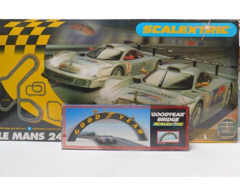 A Scalextric Le Mans 24 Hour Set, including a Mercedes SLK GT1, No 1 and No 2 Cars, boxed, together with a Scalextric Goodyea
