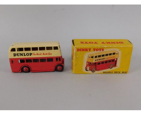 A Dinky die cast Double Decker Bus, red advertising Dunlop The World's Master Tyre, 290, boxed.