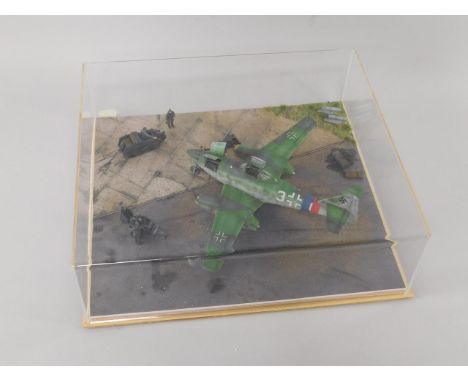 A die cast model of a WWII Luftwaffe Messerschmitt NE 262, diorama with ground crew, scale 1:48, perspex cased.