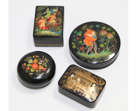 19th century black lacquered snuff box decorated the lid with gilded Oriental figure and pagoda scene.  7cm wide and 3 Russia