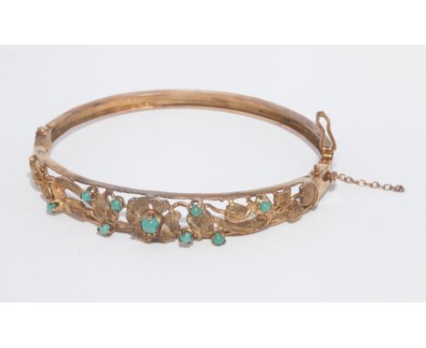 9ct yellow gold hinged bangle, with floral decoration inset with cabochon turquoise. weight approx 13.4 grams