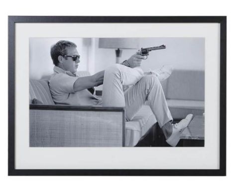 AFTER JOHN DOWNING, Steve McQueen with a gun, photographic print, framed and glazed, 54cm x 74cm. 