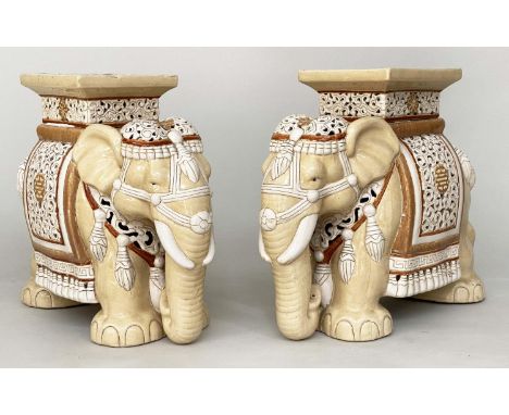 ELEPHANT STANDS, a pair, 44cm H, cream and white ceramic, in Caparison attire. (2) 