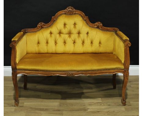 A Victorian mahogany window seat, button back, stuffed over upholstery, serpentine seat, 86cm high, 104cm wide. 