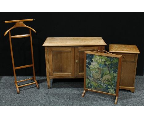 A 20th century pine side cabinet, rectangular top above a pair of cupboard doors enclosing a shelf, 73cm high, 91.5cm wide, 4