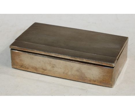A silver rectangular cigarette box, engine turned, pop-up mechanism, Chester 1931, 15.5cm wide 