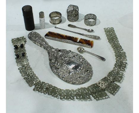 A silver hand mirror, Chester 1903; a hobnail cut silver mounted salts bottle, Birmingham 1894; a silver napkin ring, three E