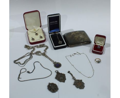 A silver cigarette case, Birmingham 1923, 127g; two silver fobs, 33.7g; a silver fob and unmarked metal Albert chain; a metal