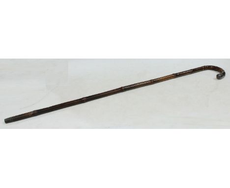 An Edwardian gentleman's silver-mounted bamboo walking stick, Birmingham 1907, 92cm high. 