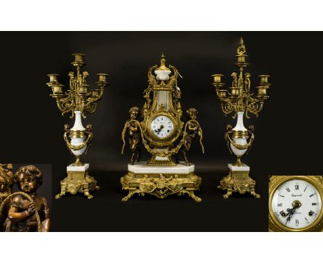 A 20th Century Brass And Marble Cased Clock Garniture In the Louis XV style, the movement by EHS of Germany. The circular ena