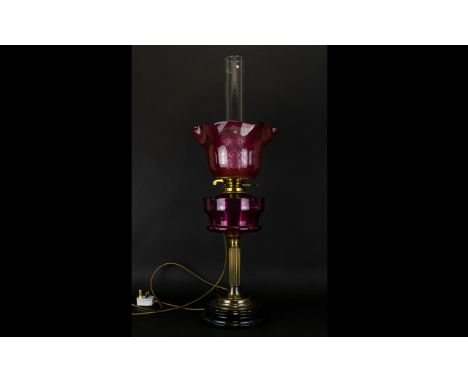 Cranberry Glass and Brass Oil Lamp Converted oil lamp on circular base with brass stand and fluted / etched cranberry glass s