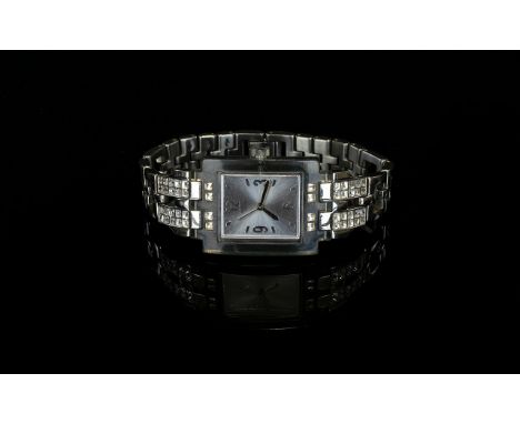 A Ladies Swatch Limited Edition Wrist Watch with a square face and jewelled bracelet.