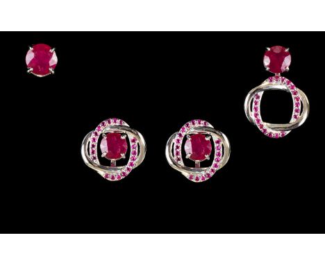 Ruby Three Way Earrings, solitaire ruby studs can be worn alone or framed with the intertwined double oval set with smaller r