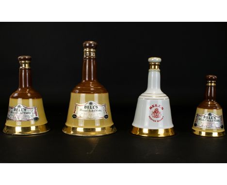 Whisky Interest. Four Bottles Of Bells Blended Scotch Whisky. One Bottle To Commemorate The Birth Of Prince Henry Of Wales.