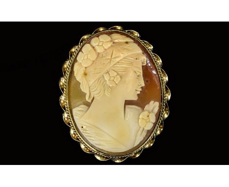 A Vintage Nice Quality Oval Shaped Shell Cameo, Depicting a Portrait of a Classical Maiden, within a 9ct Gold Mount. Fully Ha