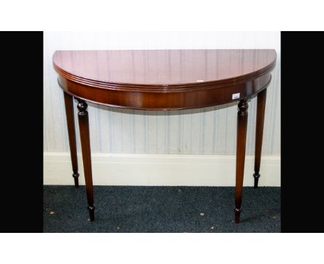 A Mahogany Gate Fold Console Table. Circular top with Neoclassical style legs and hinged top. Dia 41 inches, height 29 inches