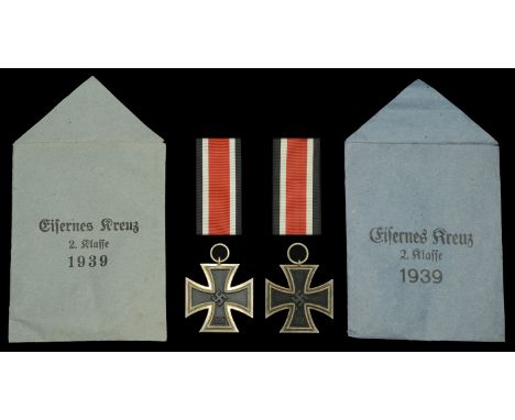 Iron Crosses Second Class 1939 in Original Presentation Packets. Two examples, the first by Klein and Quenzer, in Presentatio